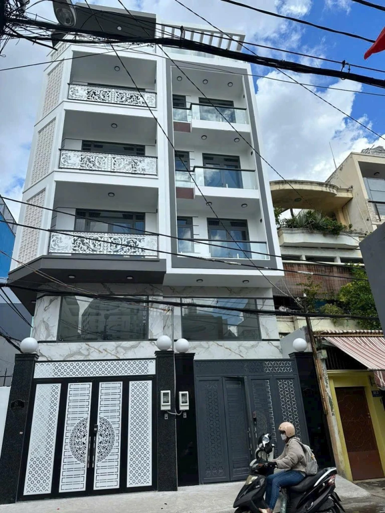 BÁN NHÀ MẶT TIỀN  ( 4.1m x 14.5m ) + 5 LẦU THANG MÁY + GẦN ĐH CÔNG NGHIỆP